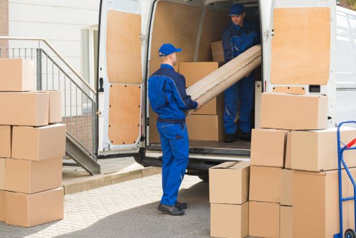 Man with van moving boxes in a Chiswick residential street