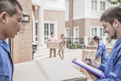Moving team handling a home removal in a Chiswick residential street