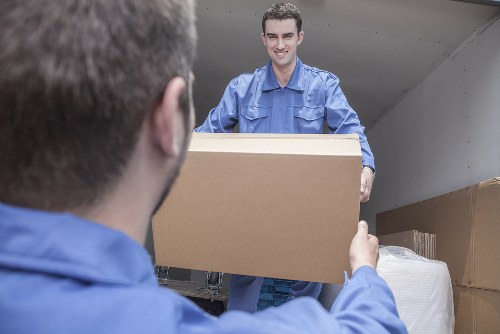 Moving boxes and furniture in a Chiswick flat