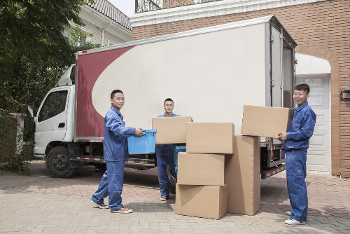 Removal team planning a local move in Chiswick with packing boxes and furniture