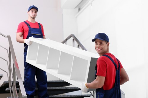 Removal team handling boxes outside a Chiswick home