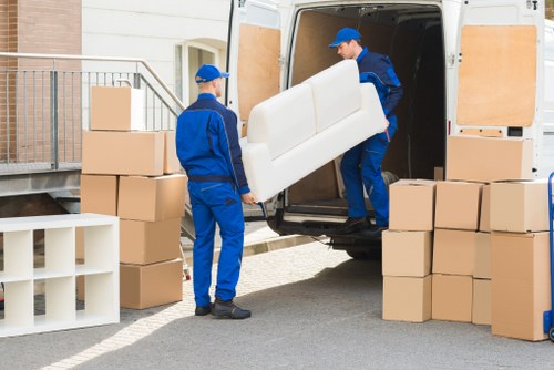 Team loading furniture for a house move in West London