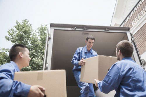 Removal van and moving boxes in a Chiswick residential street