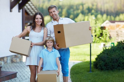 Packed moving boxes and furniture prepared for a house move in Chiswick