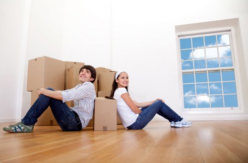 Local movers handling furniture in a Chiswick street