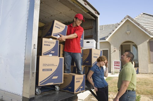 Professional removal crew handling fragile items in West London