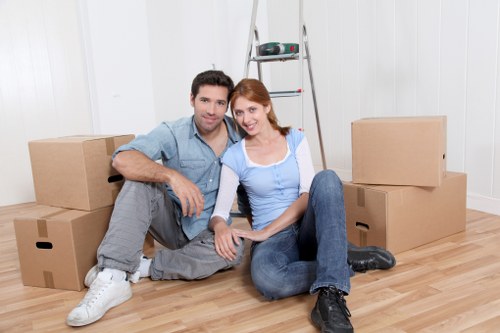 Careful wrapping of fragile household items during packing