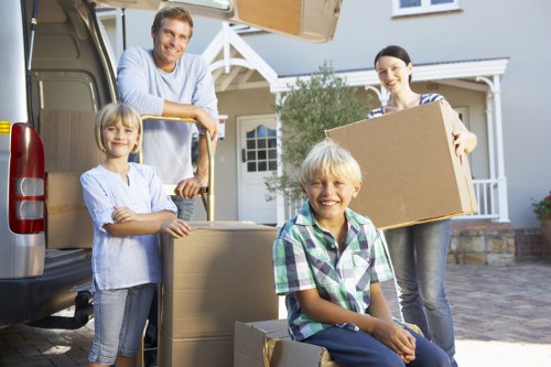 Boxes and furniture being loaded into a moving van
