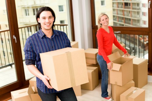 Professional movers handling furniture in a Chiswick flat move